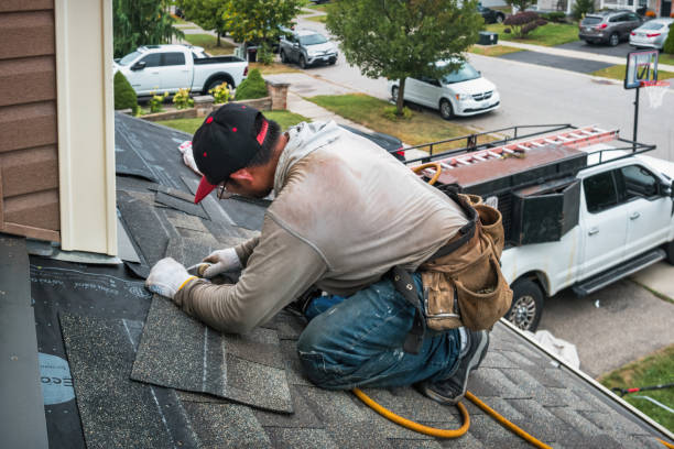 Professional Roof Replacement technician working in Delmont, PA